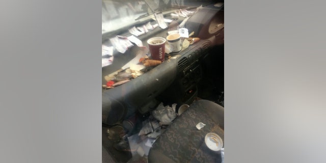 A witness took a number of photos of the car, which show a significant amount of rubbish inside including receipts, pastries and coffee cups.
