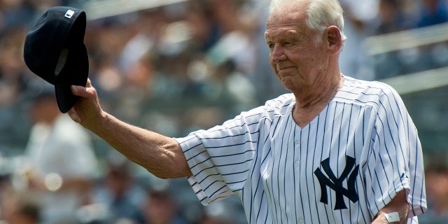 Former New York Yankees pitcher Don Larsen tips his cap during introductions for the 65th Old Timers' Day game in New York on June 26, 2011.
