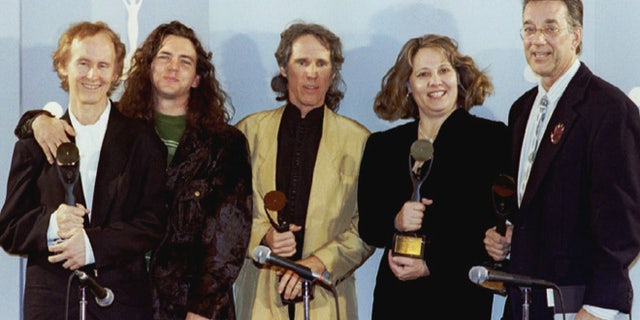 Members of The Doors pose after being inducted in the Rock 'n' Roll Hall of Fame. From left are guitarist Robby Krieger, Pearl Jam's Eddie Vedder (who presented the award), drummer John Densmore, Anne Cheuring (sister of the late Jim Morrison) and keyboardist Ray Manzarek.