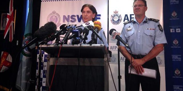 Feb. 11, 2015: Australian Federal Police Deputy Commissioner Michael Phelan, right, listens as New South Wales Deputy Police Commissioner Catherine Burn speaks during a media conference in Sydney. (Reuters/Lincoln Feast)