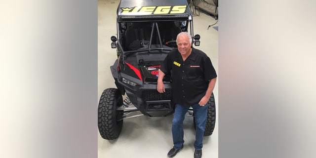 This photo provided by Don Prudhomme Racing shows Don Prudhomme posed at his shop in Vista, Calif., in March 2018. Don Prudhomme had no clue what he was doing the first time he entered the Baja 1000. The legendary drag racer made it about 100 miles before blowing an engine. Now, 50 years later, he gets to try again. The 77-year-old Prudhomme will return to Baja for the Mexican 1000 next week, his first competitive race since retiring from NHRA in 1994. (Donna Prudhomme/Don Prudhomme Racing via AP)