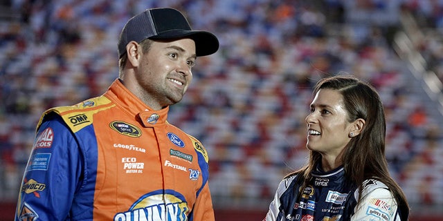 FILE - In this Oct. 6, 2016, file photo, Danica Patrick, right, talks with Ricky Stenhouse Jr, before qualifying for Saturday's NASCAR Sprint Cup series auto race at Charlotte Motor Speedway in Charlotte, N.C. Danica Patrick and Ricky Stenhouse Jr. have ended their nearly five-year relationship. A spokeswoman for Patrick confirmed to The Associated Press on Monday, Dec. 18, 2017,  that the race car drivers "are no longer in a relationship." (AP Photo/Chuck Burton, File)