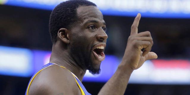 Golden State Warriors forward Draymond Green reacts to the Utah Jazz fans in the second half during Game 3 of the NBA basketball second-round playoff series Saturday, May 6, 2017, in Salt Lake City. Warriors won 102 - 91. (AP Photo/Rick Bowmer)