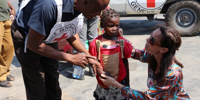 Euphrasie was only four years old when she became separated from her parents amid clashes in April 2013. She lived with her adoptive parent – an army sergeant – until her father contacted us to help locate his daughter. Now aged nine, Euphrasie is finally back with her family. Christine Cipolla, head of the ICRC delegation in the DRC, is seen here trying to offer the girl some comfort and put her mind at ease. “Children always need time to readjust, especially when they were separated at such a young age. They often have no recollection of their birth parents. So we have processes in place to ease the transition back into the family.”