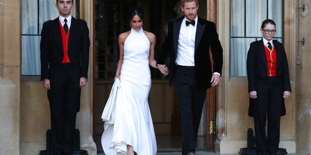 The newly married Duke and Duchess of Sussex, Meghan Markle and Prince Harry, leaving Windsor Castle after their wedding to attend an evening reception at Frogmore House, hosted by the Prince of Wales Windsor, Britain, May 19, 2018.