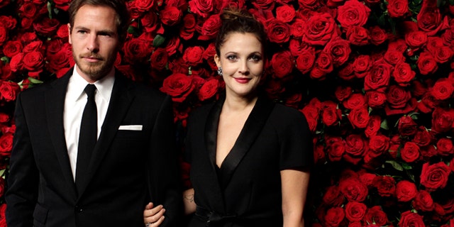 November 15, 2011. Actress Drew Barrymore (R) and Will Kopelman (L) attend the Museum of Modern Art's fourth annual Film Benefit in New York.