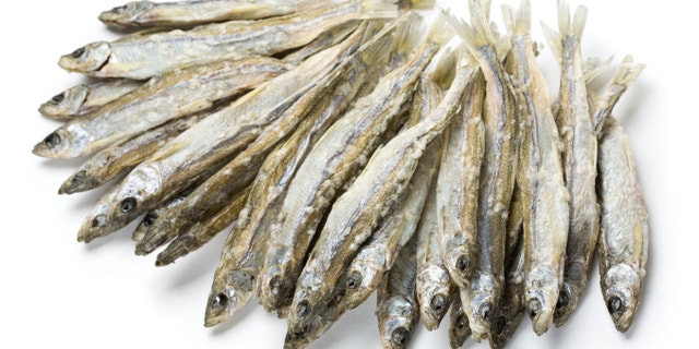 Dried salted sprat isolated on white.