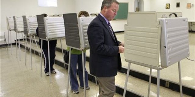 Shown here is ex-Rep. Steve Driehaus as he walks to a booth to vote in Covedale, Ohio, on Nov. 2, 2010. Driehaus lost the election.
