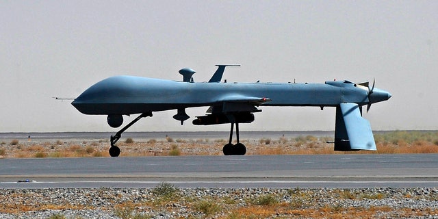 June 13, 2010: U.S. Predator unmanned drone armed with a missile stands on the tarmac of Kandahar military airport in Afghanistan.