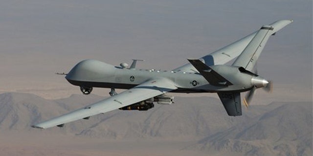 A MQ-9 Reaper, armed with GBU-12 Paveway II laser guided munitions and AGM-114 Hellfire missiles, is piloted by Col. Lex Turner during a combat mission over southern Afghanistan.