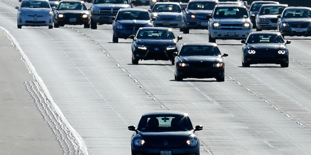 Vehicles travel north from San Diego to Los Angeles along Interstate Highway 5 in California December 10, 2013. (REUTERS/Mike Blake)