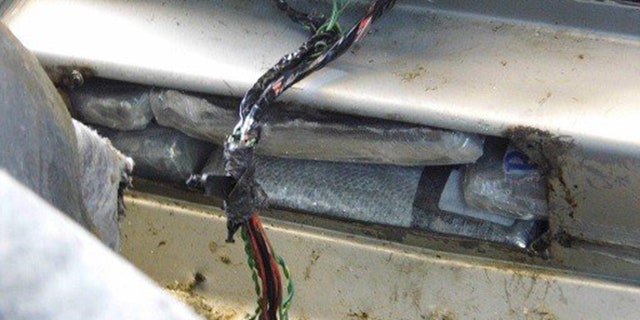 A U.S. Customs and Border Protection detector dog alerted officers to the driver-side rocker panel of the 2011 Chrysler 200 that the elderly American citizen was driving, officials say.