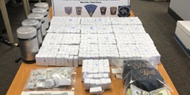 Over $250,000 and approximately 50,000 bags of heroin were seized in a series of raids conducted this week by Massachusetts State Police.