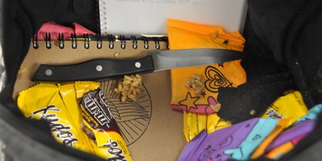 Police found the kitchen knife among a notebook and snack bars inside the girls' backpack.