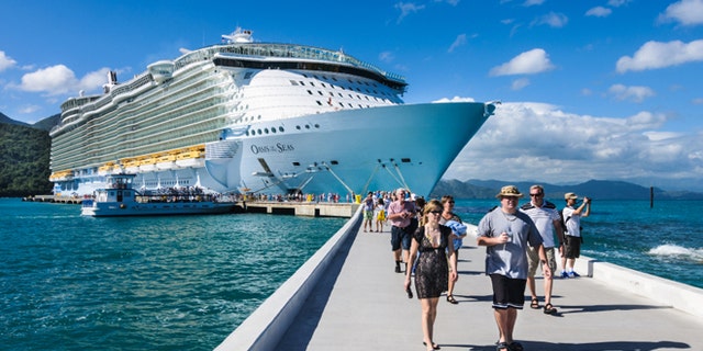 Passengers disembark the Royal Caribbean Cruise ship the Oasis of the Seas for a day of beach activities. With a passenger capacity of over six thousand, the Oasis of the Seas is the largest cruise ship in the world to date.