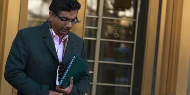 Jan. 24, 2014: Conservative commentator and best-selling author, Dinesh D'Souza exits the Manhattan Federal Courthouse in New York.