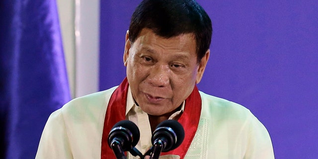 FILE - In this Aug. 2, 2017 file photo, Philippine President Rodrigo Duterte speaks during the 113th Founding Anniversary of the Bureau of Internal Revenue in metropolitan Manila. The Philippine president says he became a local millionaire at a young age due to inheritance and reiterated he has no unexplained wealth as alleged by his leading critic, who questioned his claim that he was born into an impoverished family. (AP Photo/Aaron Favila, File)
