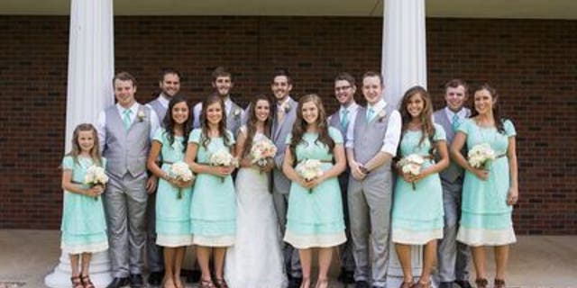 June 21, 2014. Jill Dillard, formerly Duggar, and Derick Dillard, both center, stand with their entire bridal party consisting of (LtoR) Johannah Duggar, Joseph Duggar, Madison McCalmon, Jinger Duggar, Jana Duggar, Daniel Dillard, Joy-Anna Duggar, Tony Dillard, Stephen Jones, Jessa Duggar, John-David Duggar, Anna Duggar prior to their wedding in Springdale, Arkansas