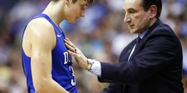 Duke guard Grayson Allen (3) talks with coach Mike Krzyzewski during game against Notre Dame in the Atlantic Coast Conference tournament in Washington on March 10, 2016.