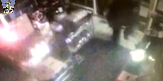 Local police say the man climbed into the store and was inside "for a brief moment" before jumping back out the window.