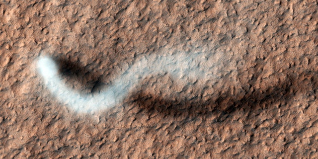 A towering dust devil casts a serpentine shadow over the Martian surface in this stunning, late springtime image captured recently by NASA. But how would it sound?