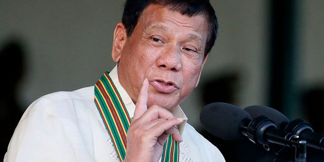 April 4, 2017 Philippine President Rodrigo Duterte gestures while addressing army troopers during the 120th anniversary celebration of the Philippine Army at Fort Bonifacio in suburban Taguig city, east of Manila.
