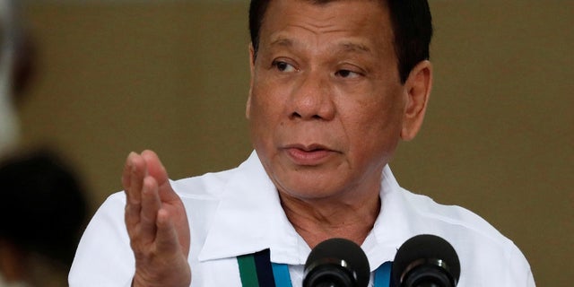 Philippines President Rodrigo Duterte gestures during Change of Command ceremonies of the Armed Forces of the Philippines (AFP) at Camp Aguinaldo in Quezon City, metro Manila, Philippines, Oct. 26, 2017.