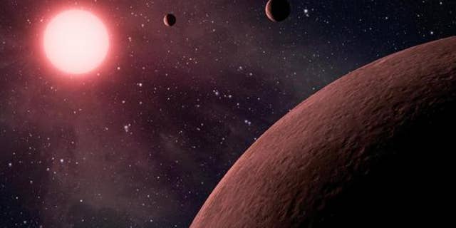 This artist's rendering shows a dwarf star and its planets. Some planets around these kinds of stars might seem habitable, but they're really "mirage planets."