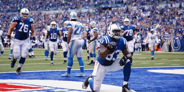 INDIANAPOLIS, IN - SEPTEMBER 11: Dwayne Allen #83 of the Indianapolis Colts reacts after a 19-yard touchdown reception against the Detroit Lions during the game at Lucas Oil Stadium on September 11, 2016 in Indianapolis, Indiana. The Lions defeated the Colts 39-35. (Photo by Joe Robbins/Getty Images)