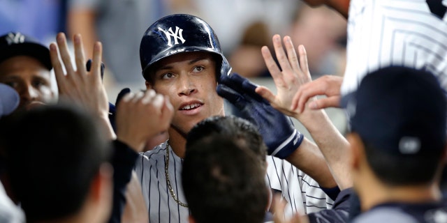 July 7: New York Yankees' Aaron Judge, center, is congratulated after his fifth-inning home run against the Milwaukee Brewers in a baseball game in in New York.