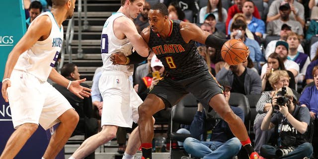 CHARLOTTE, NC - MARCH 20: Dwight Howard #8 of the Atlanta Hawks handles the ball during a game against the Charlotte Hornets on March 20, 2017 at Spectrum Center in Charlotte, North Carolina. NOTE TO USER: User expressly acknowledges and agrees that, by downloading and/or using this photograph, user is consenting to the terms and conditions of the Getty Images License Agreement. Mandatory Copyright Notice: Copyright 2017 NBAE (Photo by Kent Smith/NBAE via Getty Images)