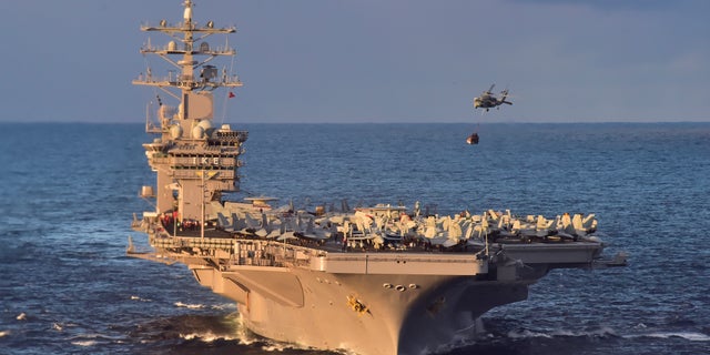 File photo - An MH-60S Sea Hawk helicopter delivers cargo to the aircraft carrier USS Dwight D. Eisenhower (CVN 69) (U.S. Navy photo by Mass Communication Specialist 3rd Class Jameson E. Lynch/Released)