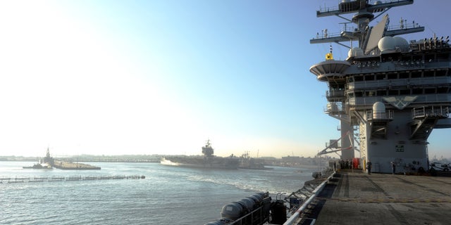 Aug. 25, 2011: The aircraft carrier USS Dwight D. Eisenhower departs Naval Station ahead of the possible landing of Hurricane Irene.