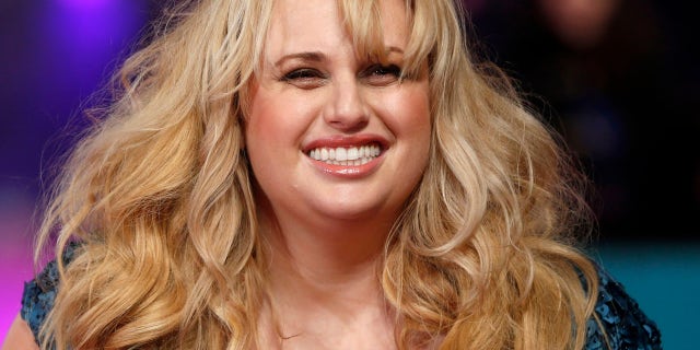 Australian actress Rebel Wilson poses for photographers at the European premiere of the film "How to be Single" in London