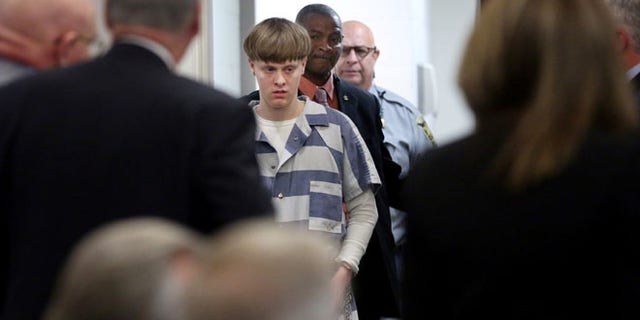 Dylann Roof is escorted into the court room at the Charleston County Judicial Center to enter his guilty plea on murder charges in state court for the 2015 shooting massacre at a historic black church, in Charleston, South Carolina, April 10, 2017. (REUTERS/Grace Beah)