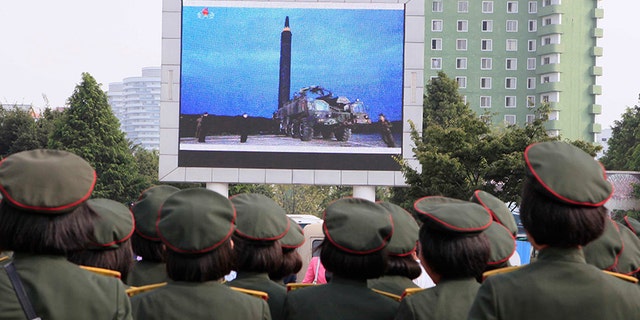 People fill the square of the main railway station to watch a televised news broadcast of the test-fire of an inter-continental ballistic rocket Hwasong-12, Aug. 30, 2017, in Pyongyang, North Korea.