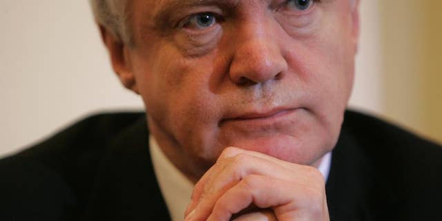 FILE - In this Wednesday, Feb. 11, 2009 file photo, the then British lawmaker David Davies attends a press conference in London. Brexit Secretary David Davis in charge of negotiating Britain’s exit from the European Union, said on Sunday July 17, 2016 that some EU citizens may not be allowed to stay after the U.K. leaves the bloc. (AP Photo/Alastair Grant, File)