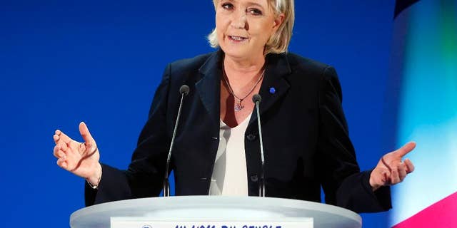 Far-right leader and candidate for the 2017 French presidential election, Marine Le Pen, addresses supporters after exit poll results of the first round of the presidential election were announced at her election day headquarters in Henin-Beaumont, northern France, Sunday, April 23, 2017. Polling agency projections show far-right leader Marine Le Pen and centrist Emmanuel Macron leading in the first-round French presidential election.