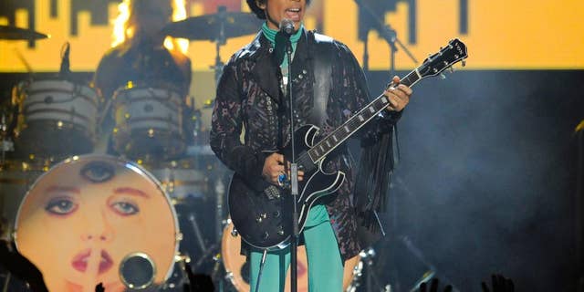 FILE - In this May 19, 2013, file photo, Prince performs at the Billboard Music Awards at the MGM Grand Garden Arena in Las Vegas. More than five months after Prince’s fatal drug overdose, investigators have narrowed their focus to two tracks: whether doctors illegally prescribed opioids meant for the pop star and whether he obtained the fentanyl that killed him from a black-market source, a law enforcement official said. (Photo by Chris Pizzello/Invision/AP, File)