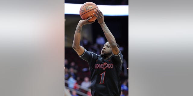 Cincinnati's Cashmere Wright shoots during the first half of an NCAA college basketball game against Seton Hall Saturday, Feb. 2, 2013, in Newark, N.J. Cincinnati defeated Seton Hall 65-59. (AP Photo/Bill Kostroun)