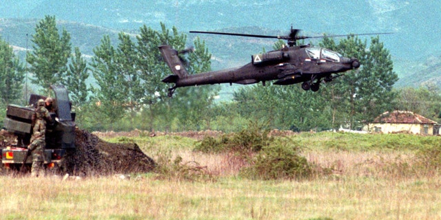 File photo: A U.S. Apache attack helicopter lands at Tirana's Rinas airport after a week of delays. MSP/JRE