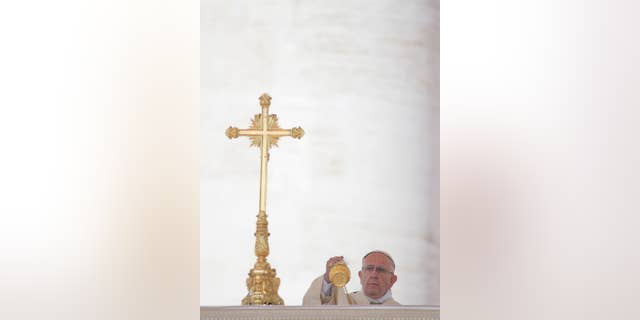 Pope Francis asperses incense as he arrives in St. Peter's Square at the Vatican for a canonization ceremony, Sunday, June 5, 2016. Pope Francis has canonized Elizabeth Hesselblad, a Lutheran convert who hid Jews during World War II and Stanislaus, the founder of the first men's religious order dedicated to the immaculate conception. (AP Photo/Alessandra Tarantino)