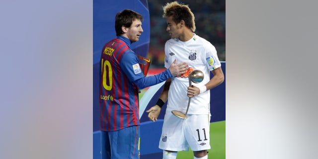 FILE.- In this Dec.18, 2011 file photo, Spain's FC Barcelona midfielder Lionel Messi, left, and Brazil's Santos FC forward Neymar congratulate at each other during an award ceremony at the Club World Cup soccer tournament in Yokohama, near Tokyo, Japan. Neymar announced Saturday May 25, 2013 he has made up his mind and will be joining Barcelona after the upcoming Confederations Cup.(AP Photo/Shizuo Kambayashi, File)