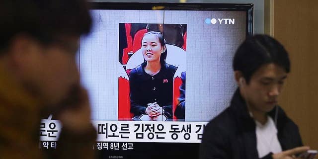 FILE - In this Nov. 27, 2014 file photo, an image of North Korean leader Kim Jong Un's younger sister Kim Yo Jong is shown on a screen broadcasting a TV news program at Seoul Railway Station in Seoul, South Korea. Kim Yo Jong is among the officials who won promotions at the country’s ruling-party congress. The state-run Korean Central News Agency reported Tuesday, May 10, 2016 that Kim Yo Jong was named a member of the Workers’ Party of Korea’s Central Committee during the congress that ended Monday. The letters read: "Kim Jong Un's sister." (AP Photo/Ahn Young-joon, File)