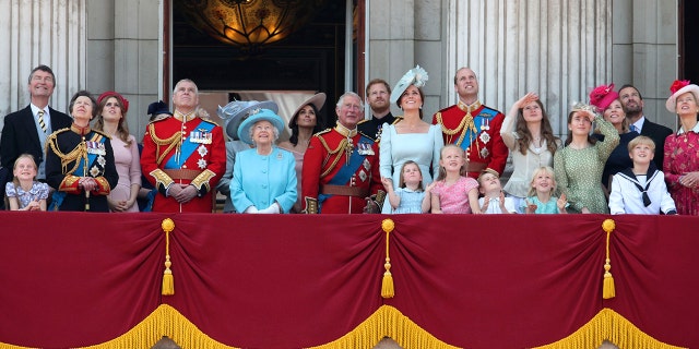 From left, Timothy Laurence, Princess Anne, Princess Beatrice, Prince Andrew, Queen Elizabeth II, Meghan, the Duchess of Sussex, Prince Charles, Prince Harry, Kate, the Duchess of Cambridge and Prince William stand with other members of the Royal family on the balcony of Buckingham Palace, following the Trooping the Colour ceremony at Horse Guards Parade as the Queen celebrates her official birthday, in London.