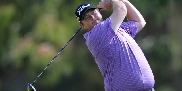 FILE - In this Feb. 19, 2012 file photo, Jarrod Lyle, of Australia, watches his drive on the second tee in the final round of the Northern Trust Open golf tournament at Riviera Country Club in Los Angeles. When cancer survivor Lyle returns to golf after a 20-month layoff at the Australian Masters in Royal Melbourne on Thursday, Nov. 14, 2013, he expects a number of teary eyes on the tee. His among them. (AP Photo/Reed Saxon, File)