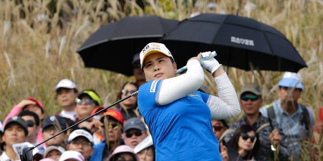 Inbee Park of South Korea watches her shot on the 9th hole during the final round of the KEB Hana Bank Championship golf tournament at Sky72 Golf Club in Incheon, South Korea, Sunday, Oct. 19, 2014.(AP Photo/Ahn Young-joon)