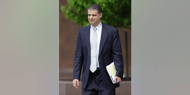 Christopher Joseph, attorney for Alexander E. Blair, leaves the federal court house in Topeka, Kan., Thursday, April 16, 2015. A judge decided Thursday to release Blair to his parents' custody, which is expected to happen by Monday. (AP Photo/Orlin Wagner)