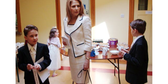 The wife and children of American oil executive Pasquale Riggi are seen in this undated photo. Riggi's twin sons and his daughter were found dead in a town house in Edinburgh, Scotland, after an explosion, though they do not appear to have died from the blast.