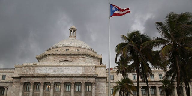 The Puerto Rican flag flies near the Capitol building. (Photo by Joe Raedle/Getty Images)